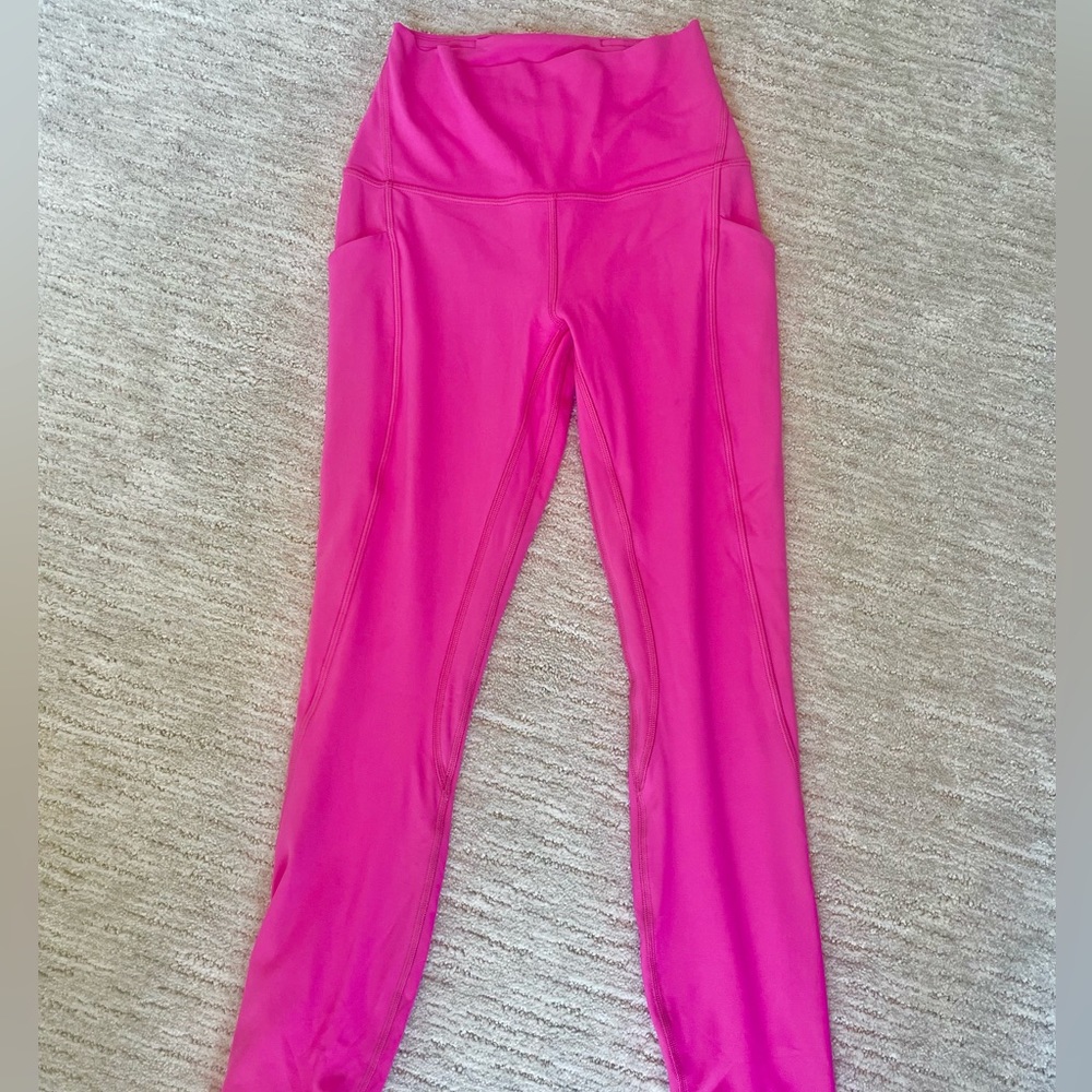 Hot pink Lululemon Align leggings.